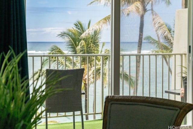 balcony featuring a water view