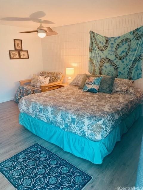 bedroom featuring hardwood / wood-style flooring and ceiling fan