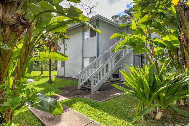 view of home's exterior featuring a yard