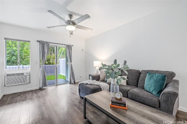 living room featuring ceiling fan, cooling unit, and wood-type flooring