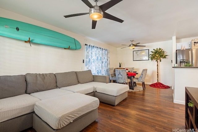 living room with ceiling fan and dark hardwood / wood-style floors