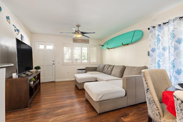 living room featuring ceiling fan and dark hardwood / wood-style flooring