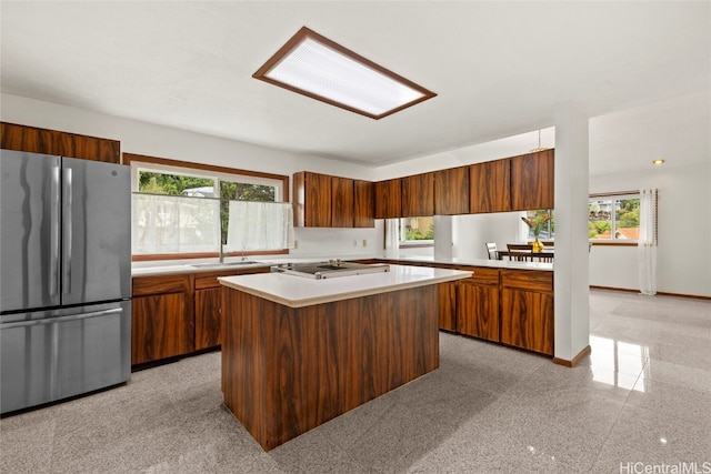 kitchen featuring a center island, sink, and appliances with stainless steel finishes