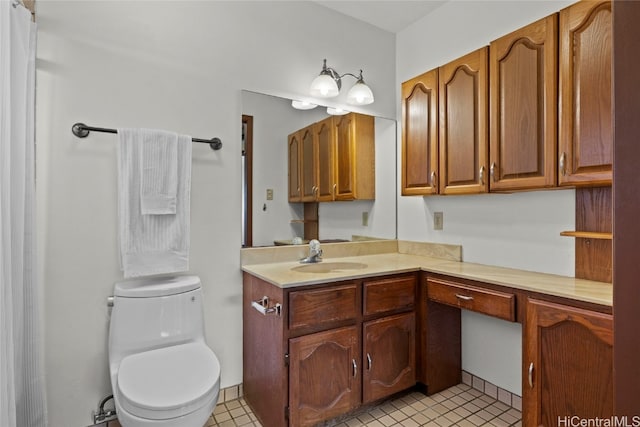 bathroom with tile patterned floors, vanity, and toilet