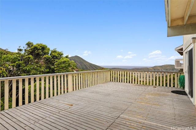 wooden deck with a mountain view