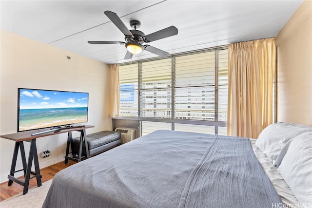 bedroom with wood-type flooring and ceiling fan