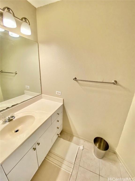 bathroom with tile patterned floors and vanity