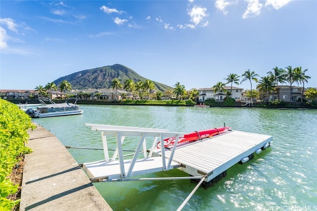 dock area with a water and mountain view