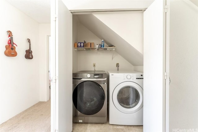 laundry room featuring light colored carpet and washing machine and clothes dryer