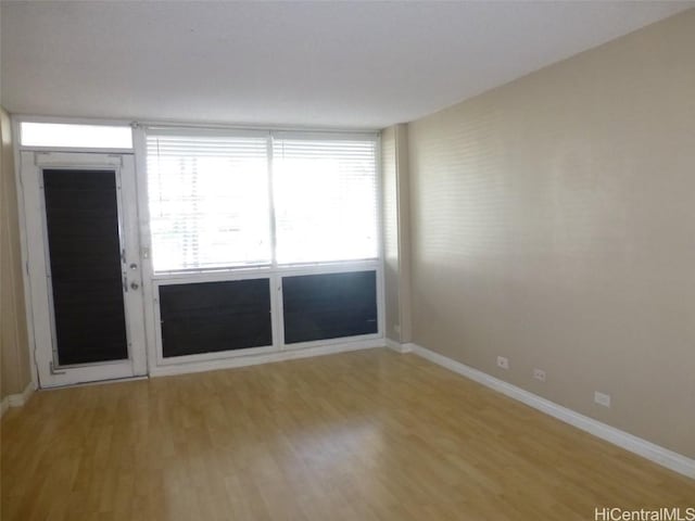 empty room with wood-type flooring