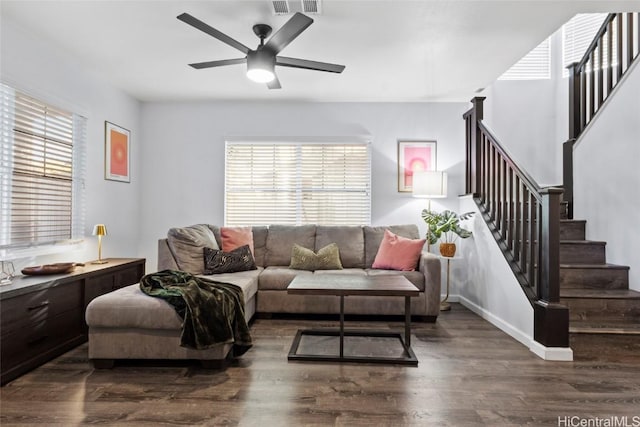 living room featuring dark hardwood / wood-style floors, plenty of natural light, and ceiling fan