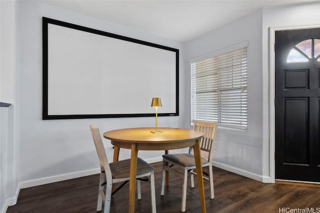 dining space featuring dark hardwood / wood-style flooring