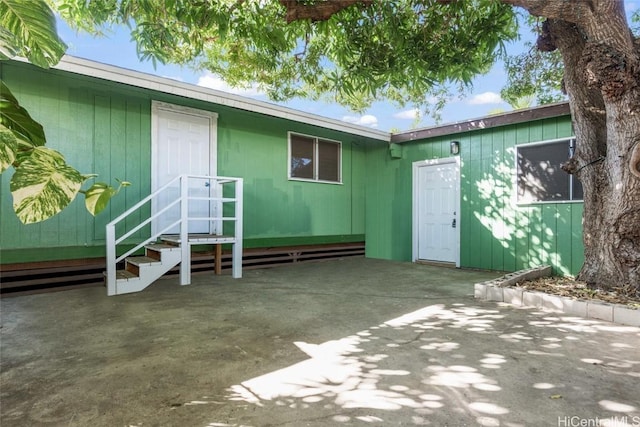 property entrance featuring a patio area