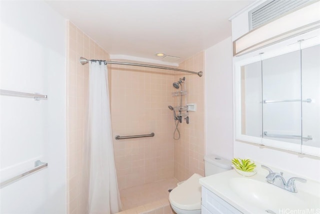 bathroom featuring a shower with curtain, toilet, and vanity