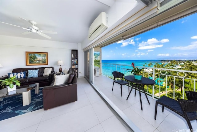 balcony featuring an outdoor living space, ceiling fan, a water view, and a wall unit AC