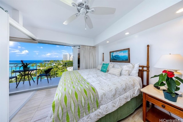 bedroom with a water view, access to exterior, and ceiling fan