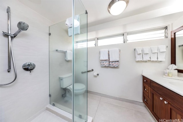 bathroom with toilet, an enclosed shower, tile patterned flooring, and a wealth of natural light