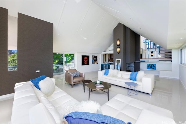 living room featuring light tile patterned floors and vaulted ceiling