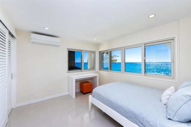 tiled bedroom featuring a wall mounted AC