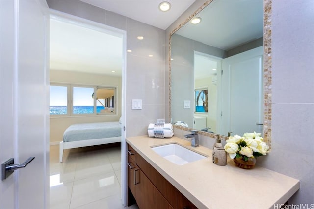 bathroom featuring tile patterned flooring and vanity