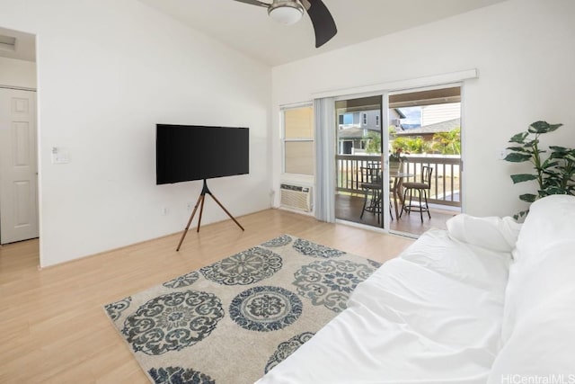 bedroom with access to outside, ceiling fan, cooling unit, and hardwood / wood-style flooring