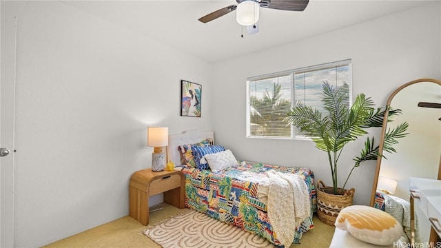 bedroom with ceiling fan and carpet