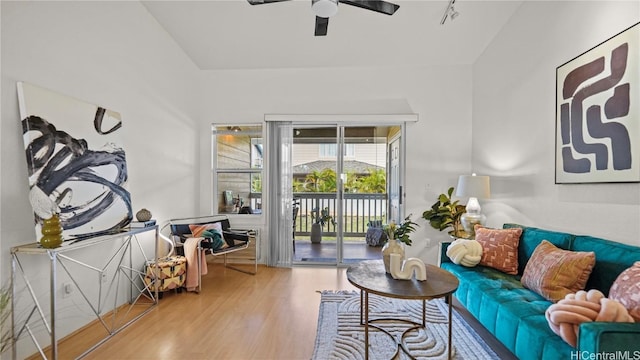 living room featuring hardwood / wood-style flooring and ceiling fan