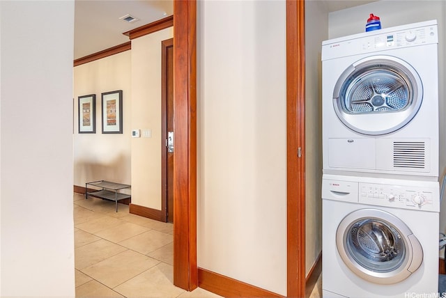 92-104 Waialii Pl Unit O523, Kapolei, HI 96707 - washroom with estacked washer and dryer and light tile patterned flooring