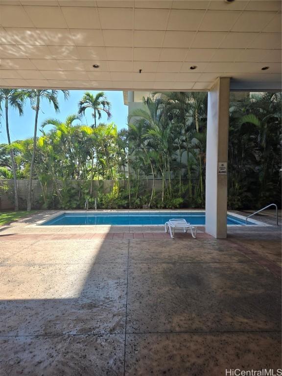 view of pool featuring a patio