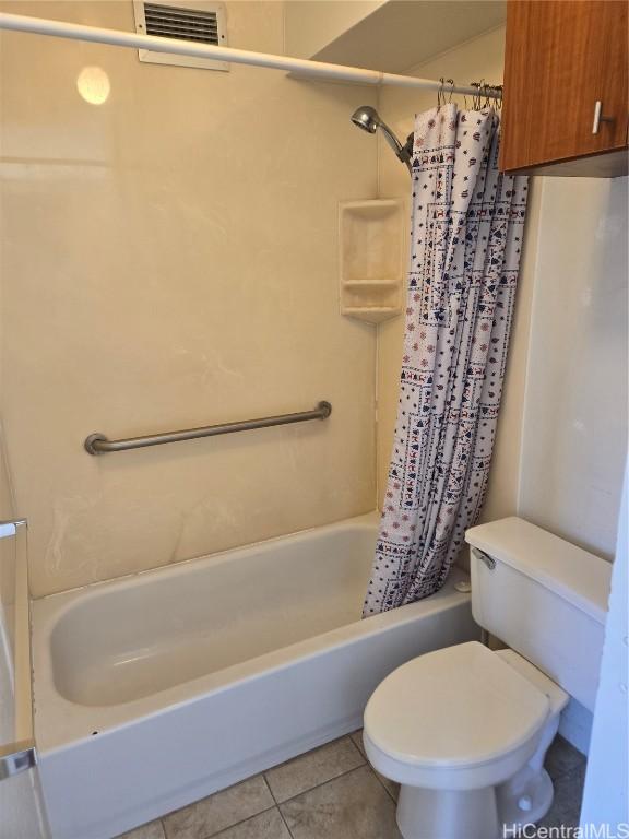 bathroom with tile patterned floors, toilet, and shower / bathtub combination with curtain