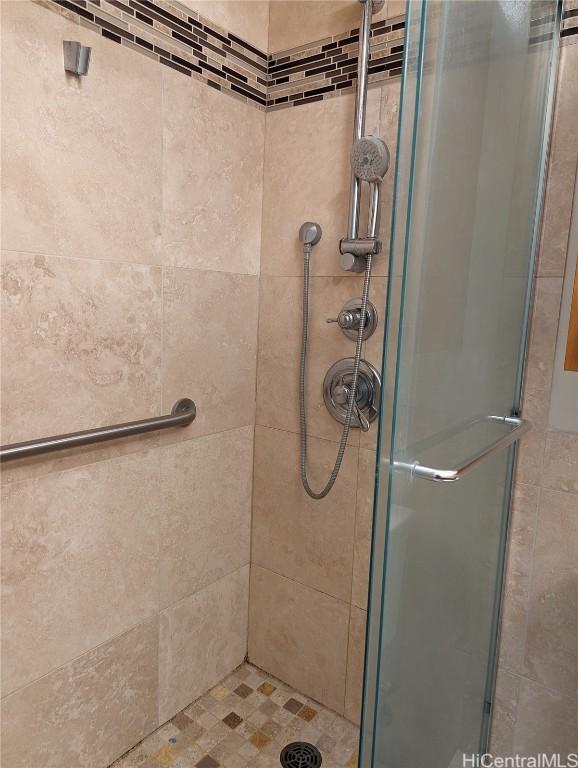 bathroom with a shower with shower door