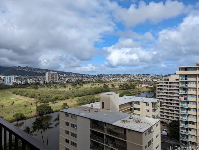 property's view of city with a mountain view