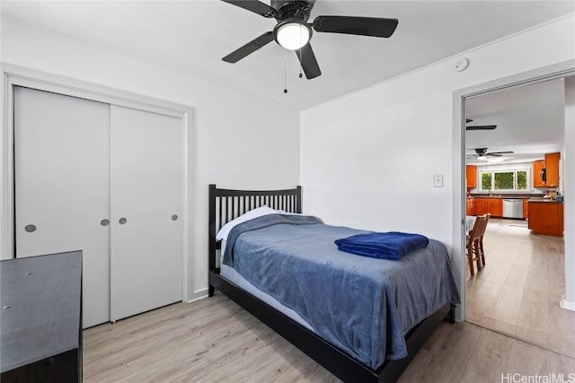 bedroom featuring a closet, ceiling fan, and light hardwood / wood-style flooring