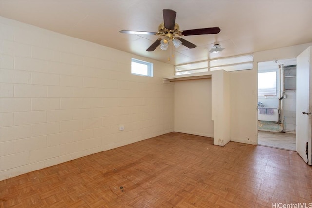 spare room featuring ceiling fan and light parquet flooring