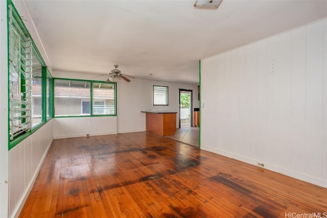 spare room featuring ceiling fan and light hardwood / wood-style floors