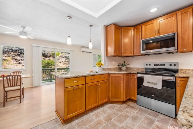 kitchen with kitchen peninsula, light stone countertops, stainless steel appliances, ceiling fan, and hanging light fixtures