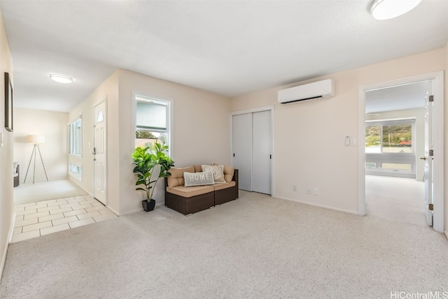 living area with a wall unit AC and light carpet