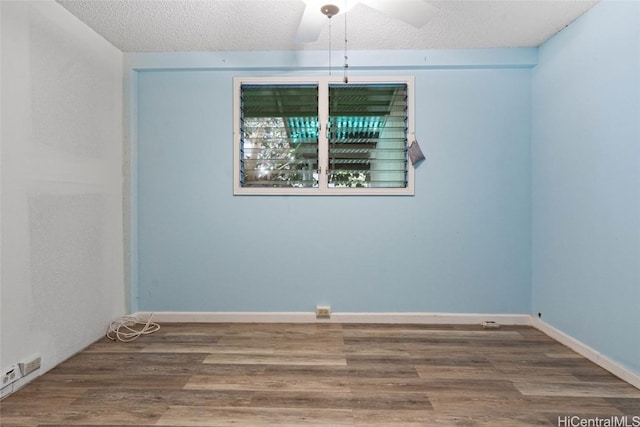 spare room with ceiling fan, a textured ceiling, and hardwood / wood-style floors