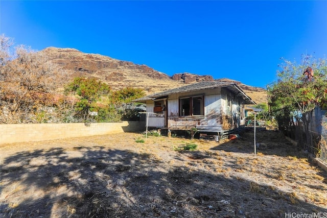 exterior space featuring a deck with mountain view