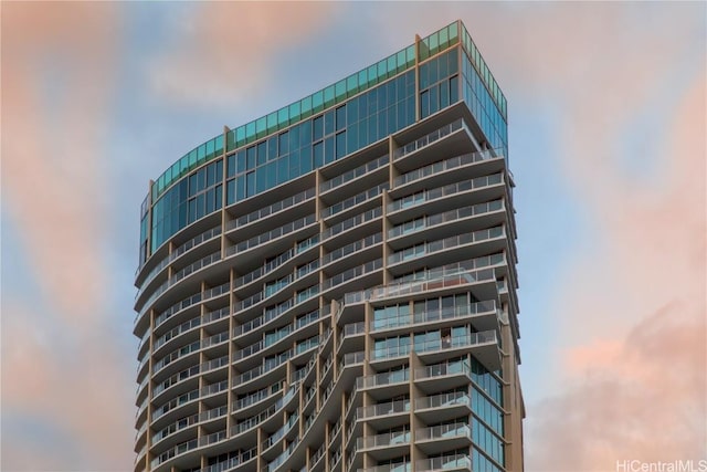 view of outdoor building at dusk