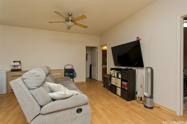 living room featuring light wood-type flooring and ceiling fan