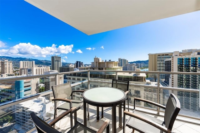 balcony featuring a mountain view