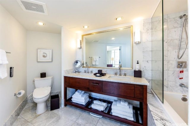 full bathroom featuring vanity, toilet, and tiled shower / bath