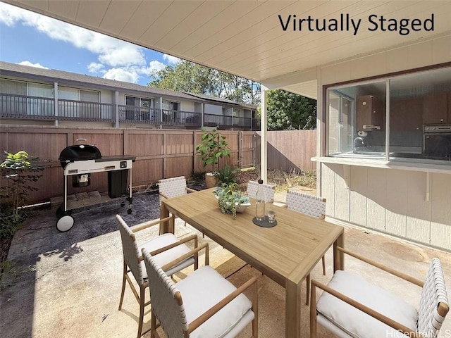 view of patio with area for grilling and sink