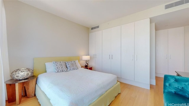 bedroom featuring a closet and light hardwood / wood-style floors