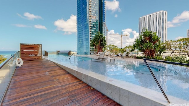 view of pool with a water view