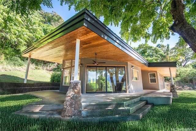 exterior space featuring a yard, a patio, and ceiling fan