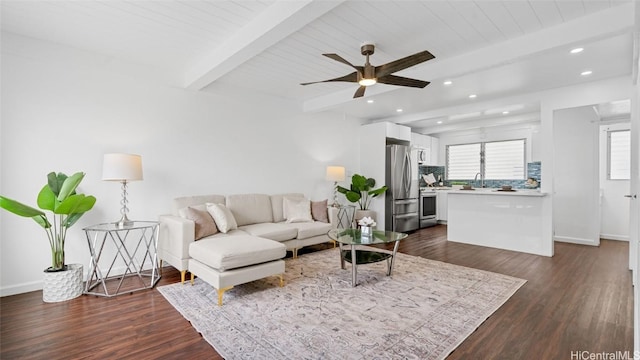 living room with beam ceiling, ceiling fan, and dark hardwood / wood-style flooring