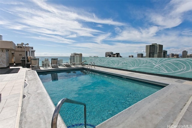 view of swimming pool featuring a patio area