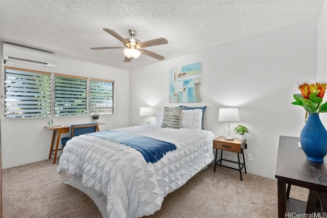 bedroom featuring a wall mounted air conditioner, ceiling fan, light colored carpet, and a textured ceiling